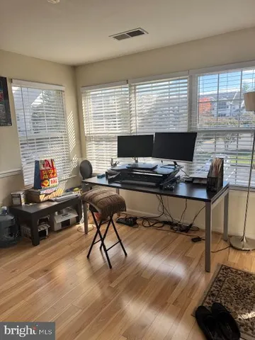 a workspace with furniture and a window