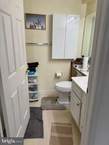 a bathroom with a sink toilet and vanity