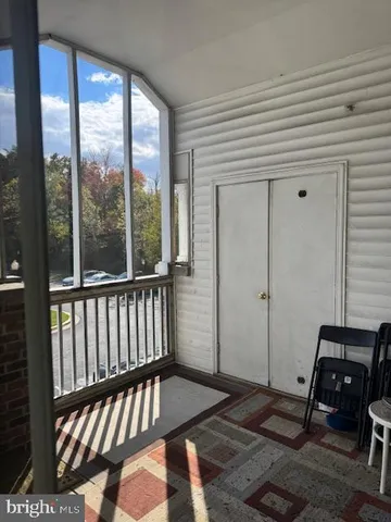 a view of a balcony with chair