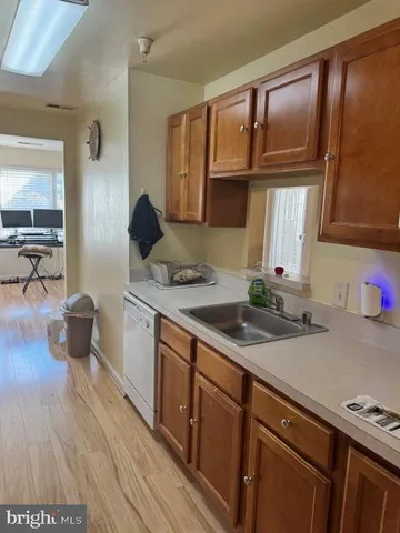 a kitchen with a sink and a stove top oven