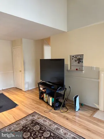 a room with furniture and a flat screen tv