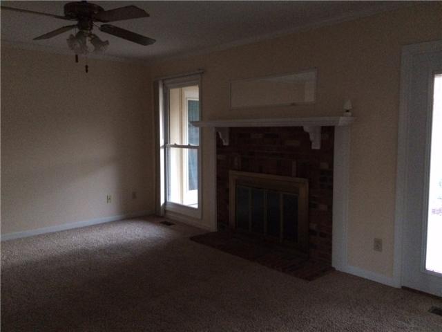 3978 New Chapel Road Springfield, TN 37172 - Photo 9 of 15 Living room with new carpet, fireplace, and
