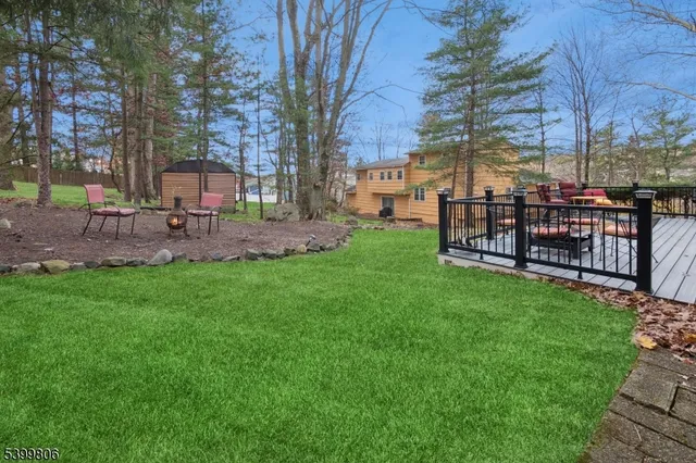 a view of a park with bench and trees