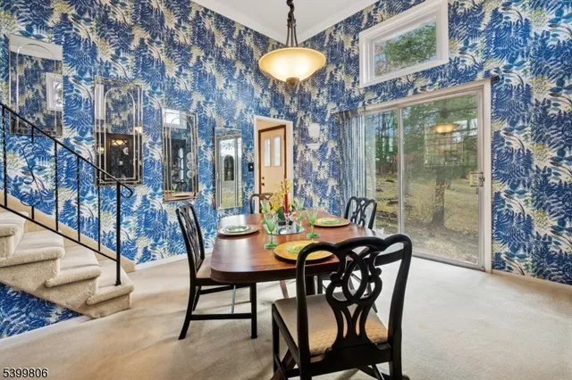 a dining room with furniture and chandelier