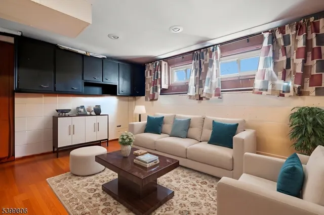 a living room with furniture and a rug