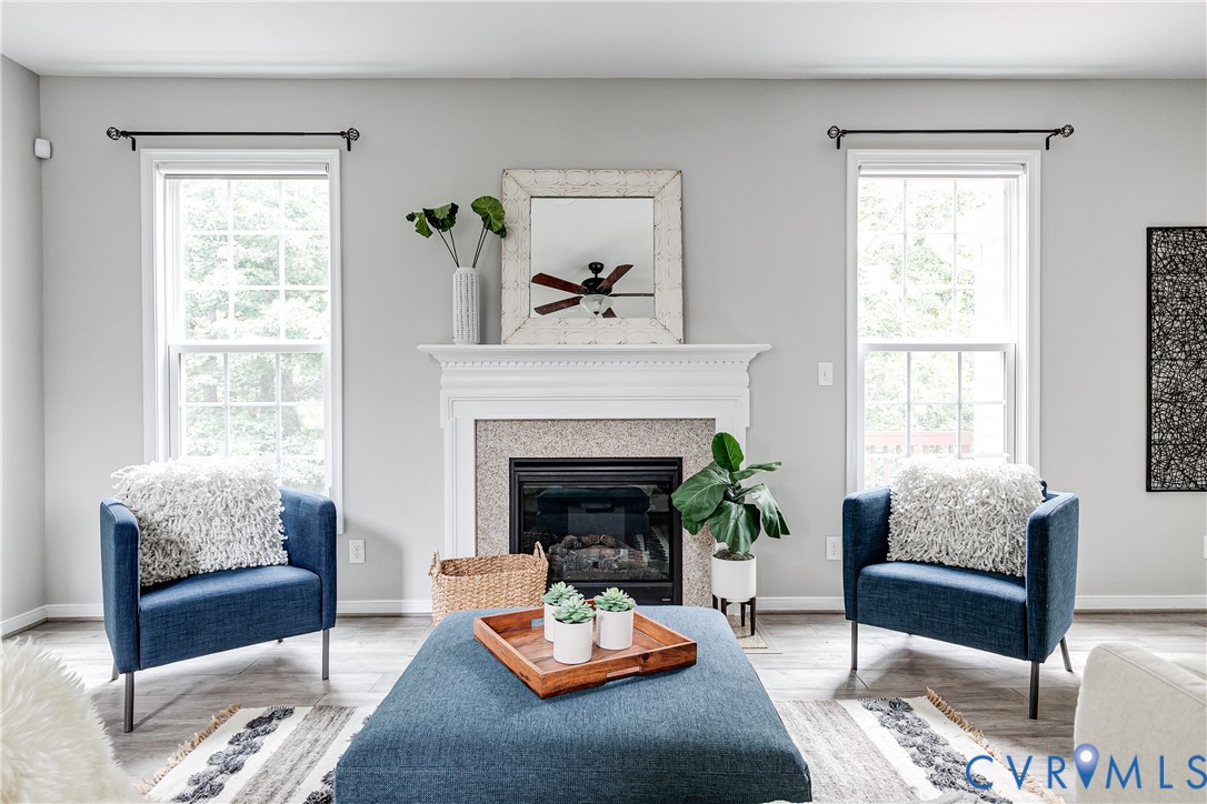 14906 Bridge Spring Drive Midlothian, VA 23113 - Photo 18 of 50 a living room with furniture and a fireplace