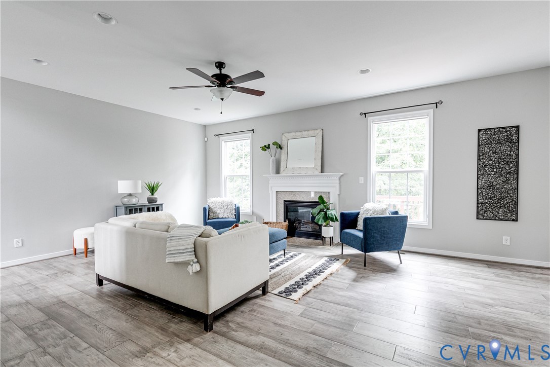 14906 Bridge Spring Drive Midlothian, VA 23113 - Photo 19 of 50 a living room with furniture ceiling fan and a window
