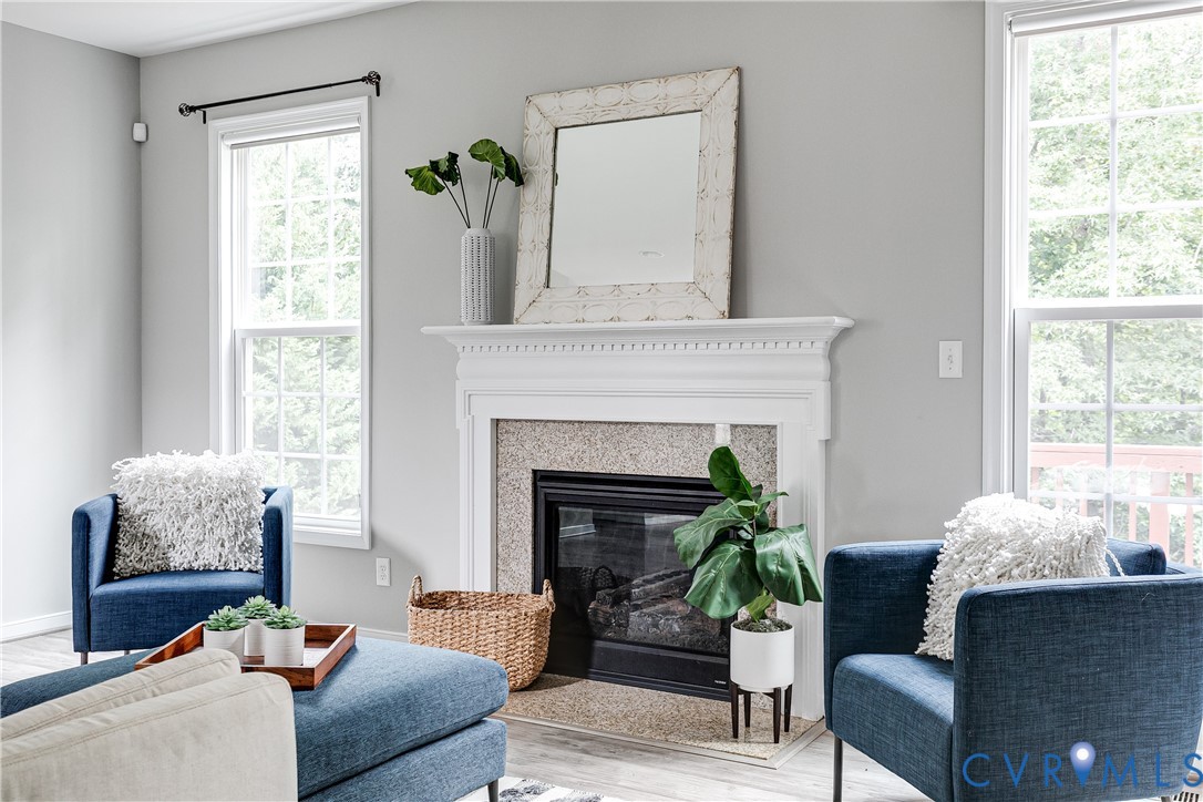 14906 Bridge Spring Drive Midlothian, VA 23113 - Photo 20 of 50 a living room with furniture and a fireplace