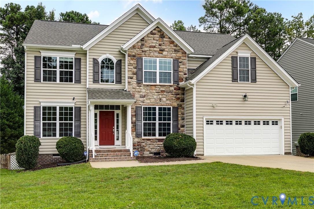 14906 Bridge Spring Drive Midlothian, VA 23113 - Photo 2 of 50 a front view of a house with a yard and garage