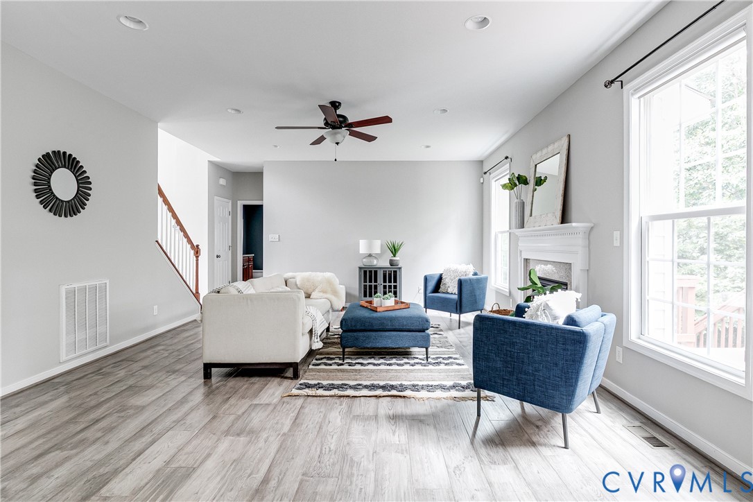 14906 Bridge Spring Drive Midlothian, VA 23113 - Photo 21 of 50 a living room with furniture a bed and a large window