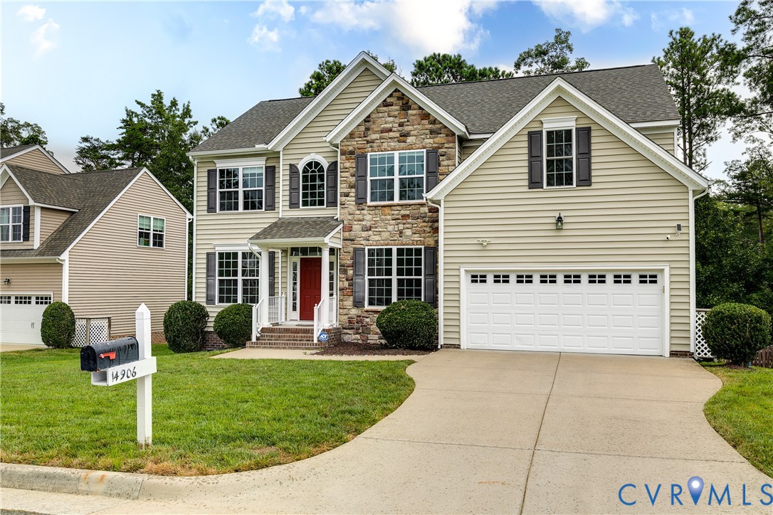 14906 Bridge Spring Drive Midlothian, VA 23113 - Photo 3 of 50 a front view of a house with a garden