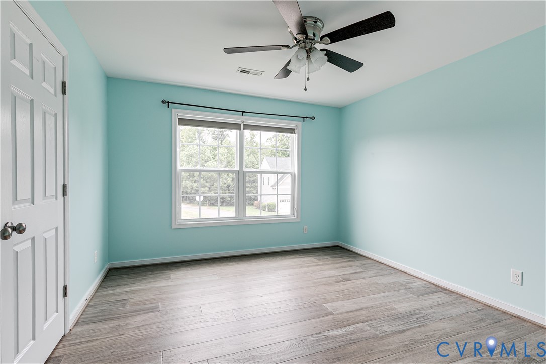 14906 Bridge Spring Drive Midlothian, VA 23113 - Photo 31 of 50 wooden floor in an empty room with a window