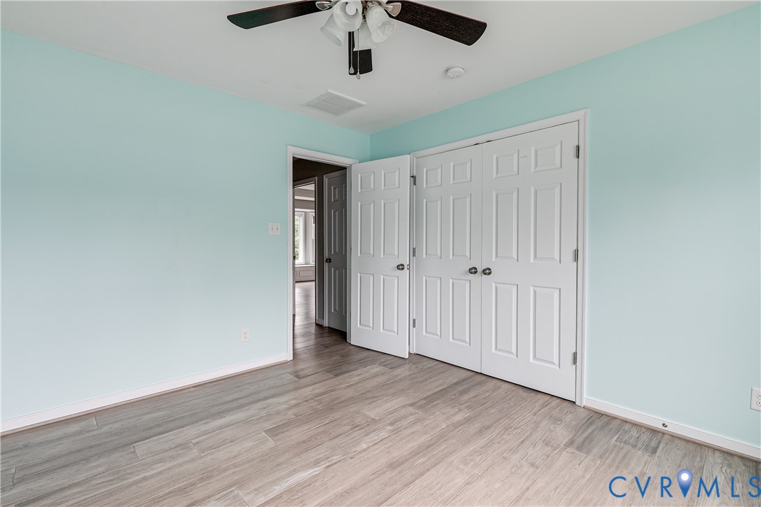 14906 Bridge Spring Drive Midlothian, VA 23113 - Photo 32 of 50 a view of an empty room with wooden floor