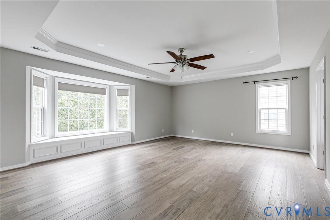 14906 Bridge Spring Drive Midlothian, VA 23113 - Photo 33 of 50 an empty room with wooden floor and windows