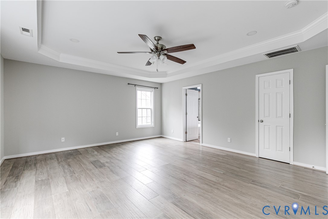 14906 Bridge Spring Drive Midlothian, VA 23113 - Photo 34 of 50 a view of an empty room with a window and wooden floor