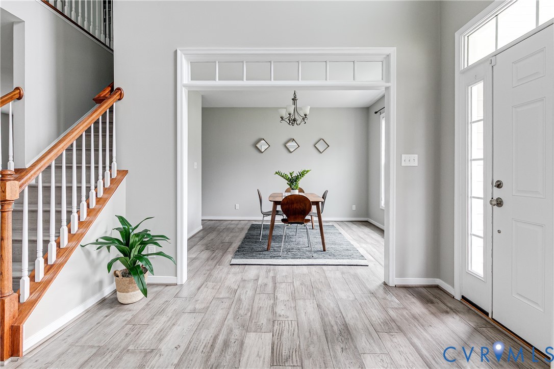 14906 Bridge Spring Drive Midlothian, VA 23113 - Photo 8 of 50 a living room with wooden floor and a potted plant