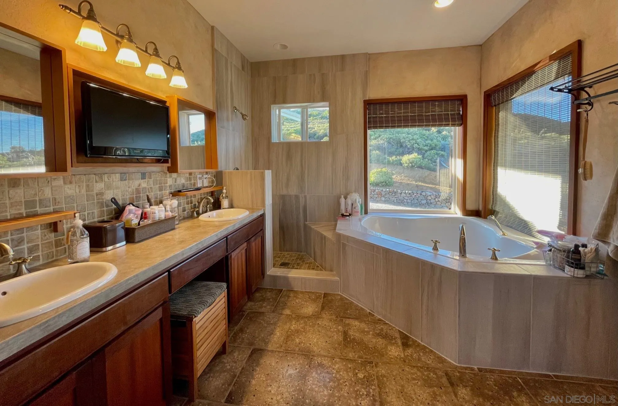 34896 Yuma Road Julian, CA 92036 - Photo 12 of 56 a bathroom with a double vanity sink a mirror and a bathtub