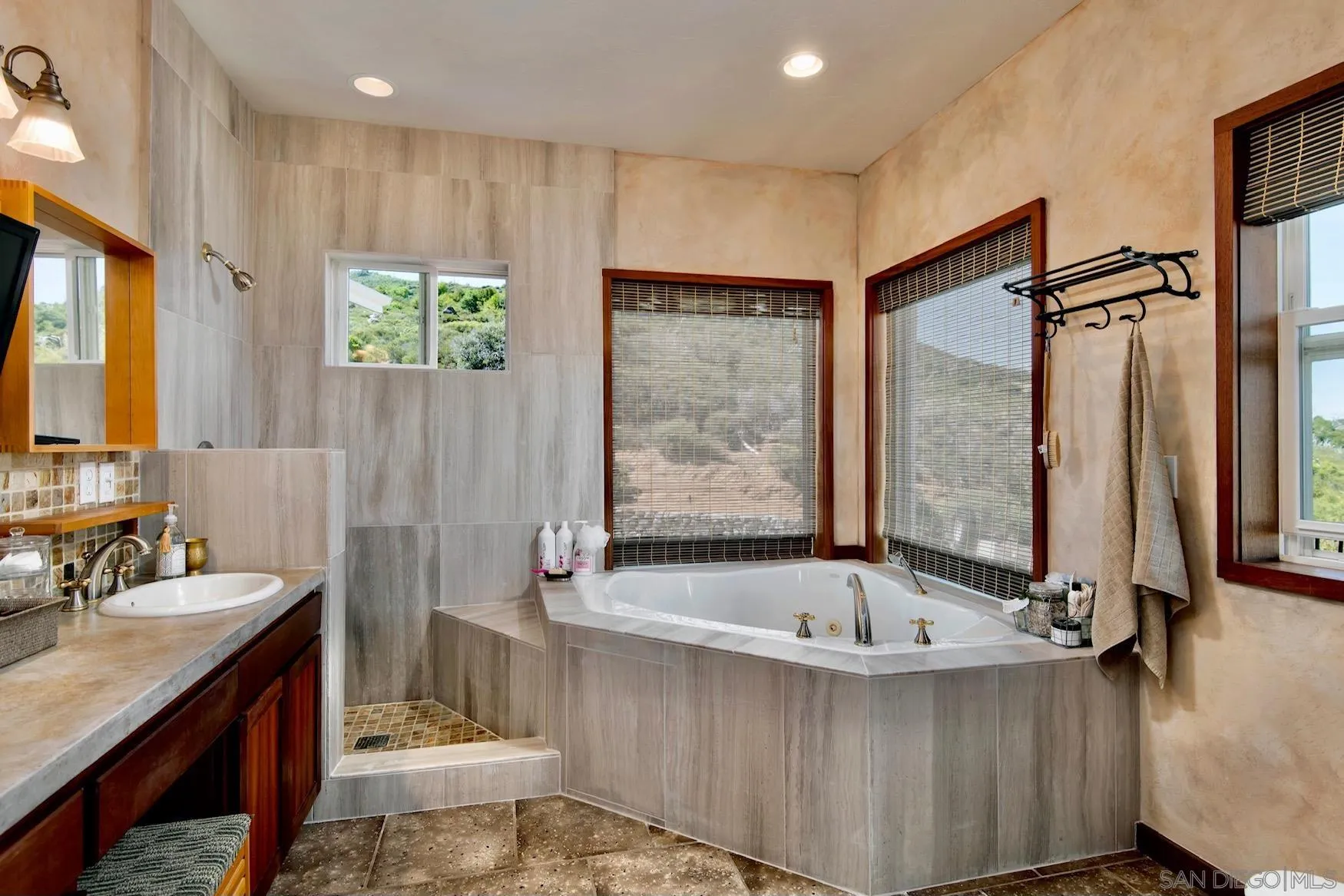 34896 Yuma Road Julian, CA 92036 - Photo 13 of 56 a bathroom with a tub a sink and a large mirror
