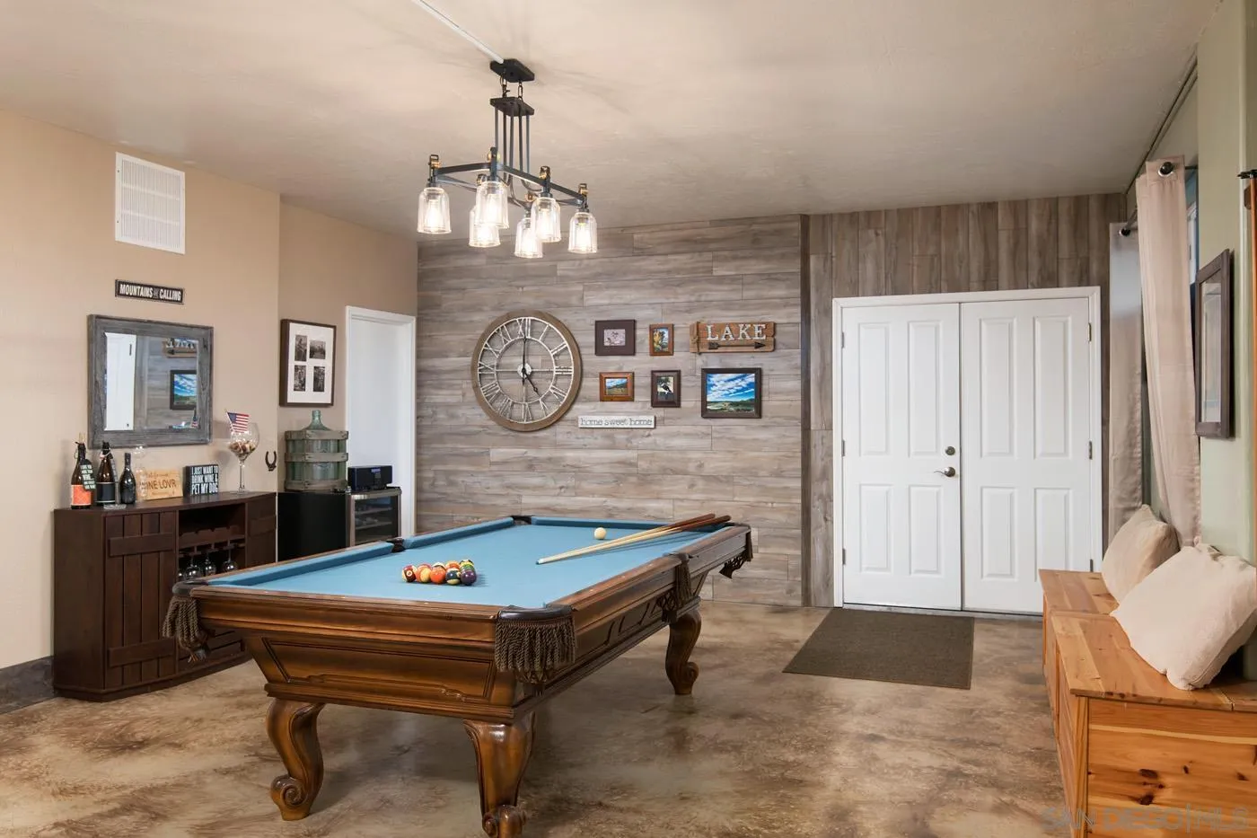 34896 Yuma Road Julian, CA 92036 - Photo 32 of 56 a living room with a table chairs and a chandelier