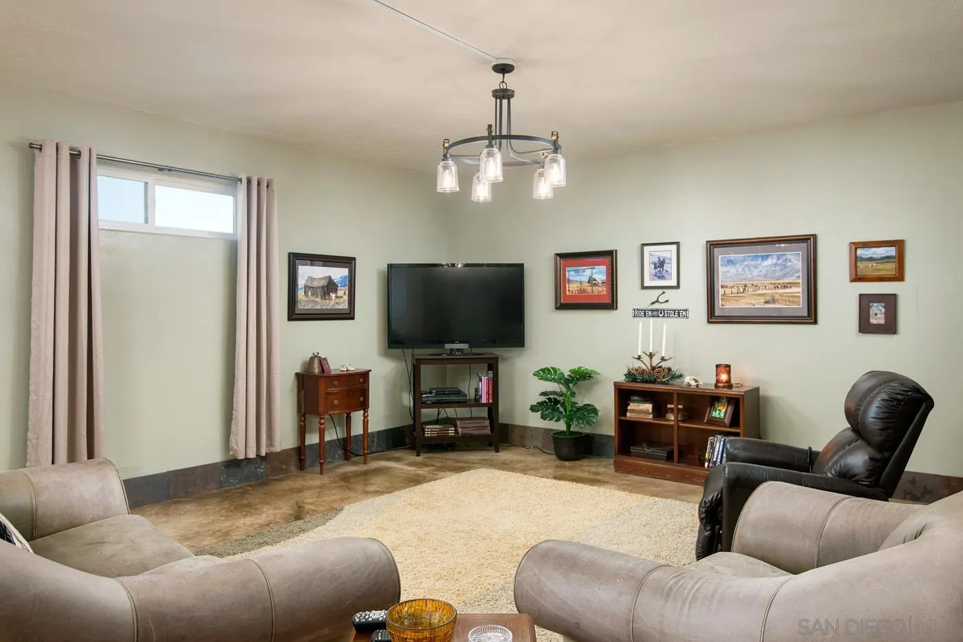 34896 Yuma Road Julian, CA 92036 - Photo 34 of 56 a living room with furniture and a flat screen tv