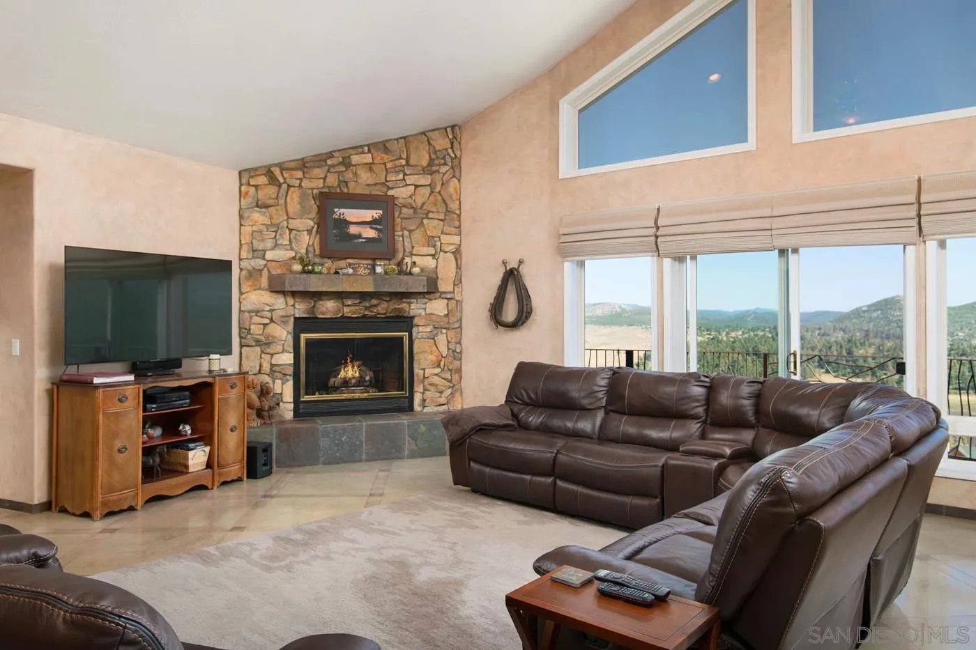 34896 Yuma Road Julian, CA 92036 - Photo 6 of 56 a living room with furniture a flat screen tv and a large window