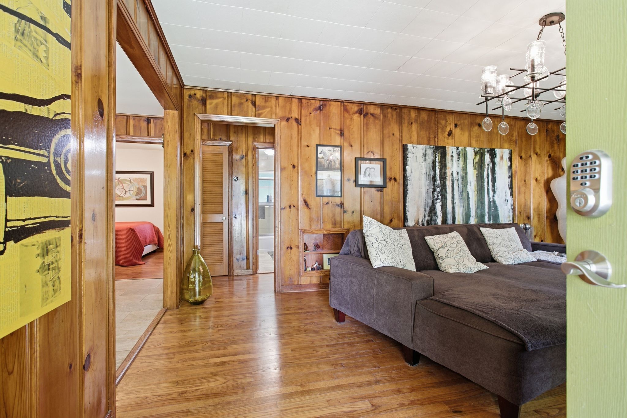 150 Toms Creek Road Linden, TN 37096 - Photo 6 of 23 a living room with furniture a chandelier and a dining table