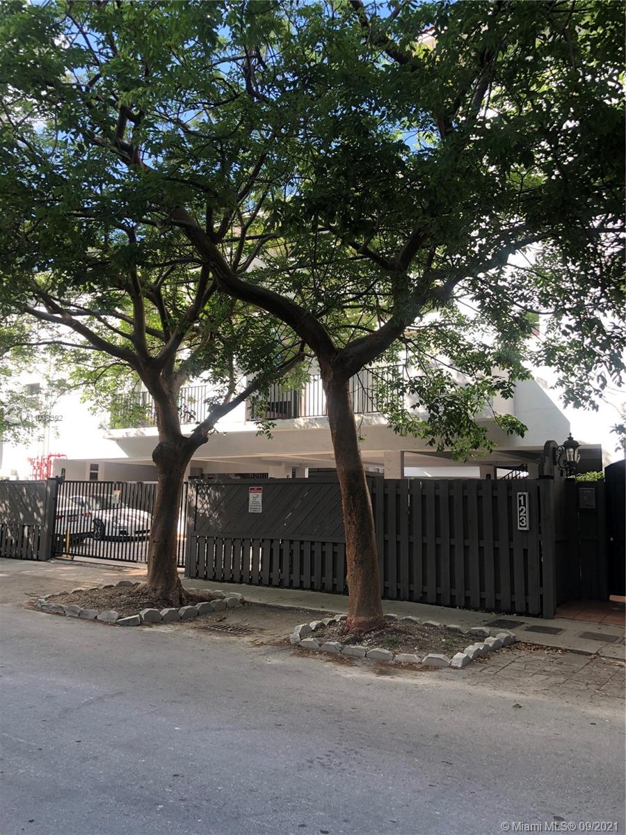 123 Southwest 17th Road Miami, FL 33129 - Photo 2 of 28 a sign board with tree in front of it
