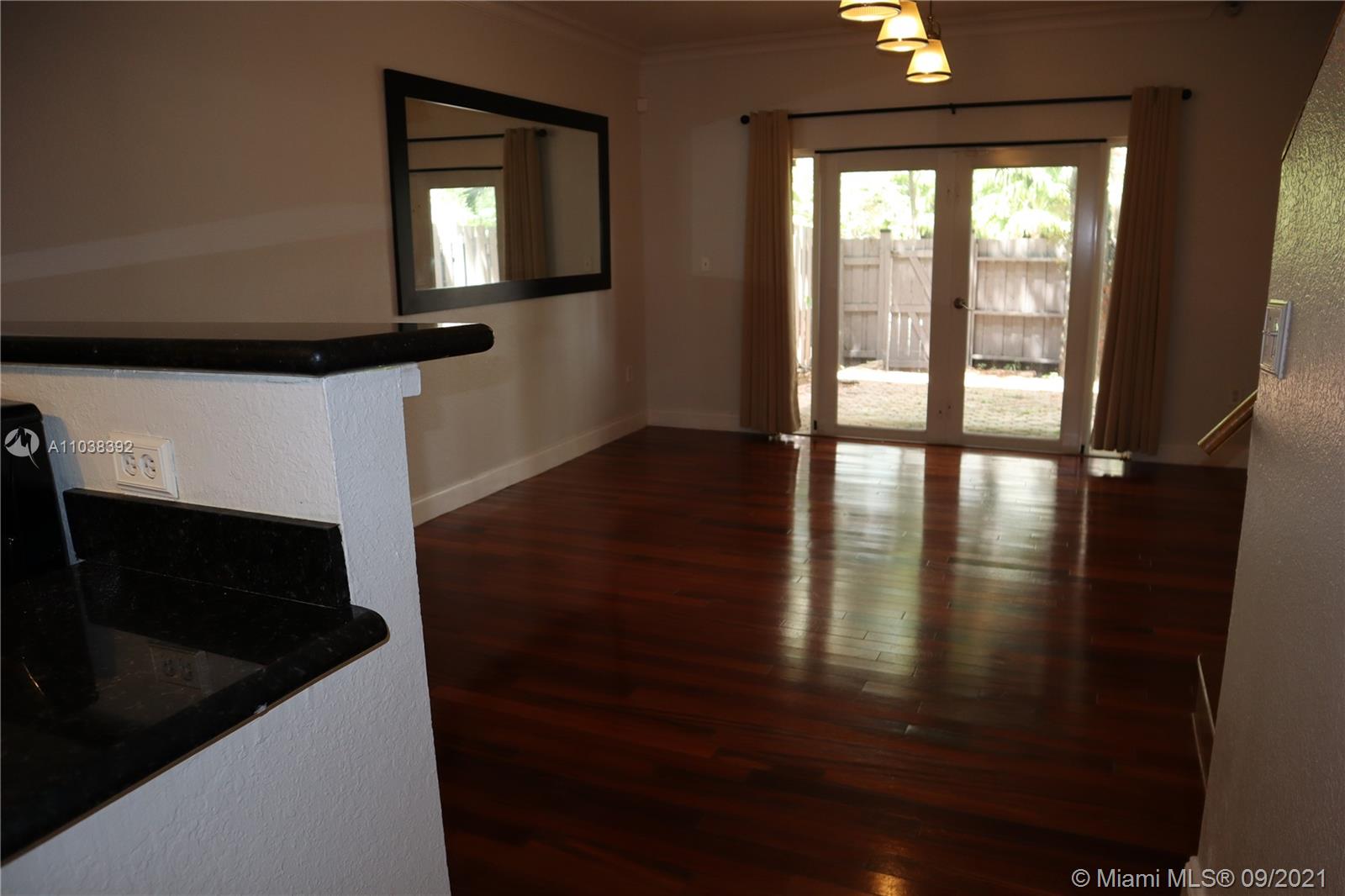 123 Southwest 17th Road Miami, FL 33129 - Photo 14 of 28 a view of a hallway with wooden floor and staircase