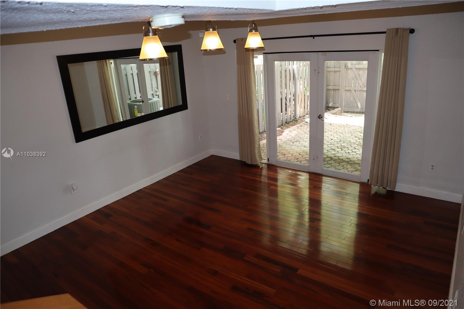 123 Southwest 17th Road Miami, FL 33129 - Photo 16 of 28 a view of an entryway with wooden floor