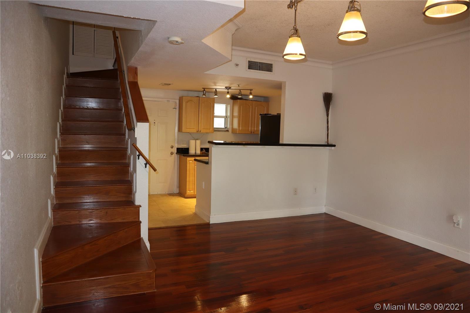 123 Southwest 17th Road Miami, FL 33129 - Photo 17 of 28 a view of a hallway with wooden floor