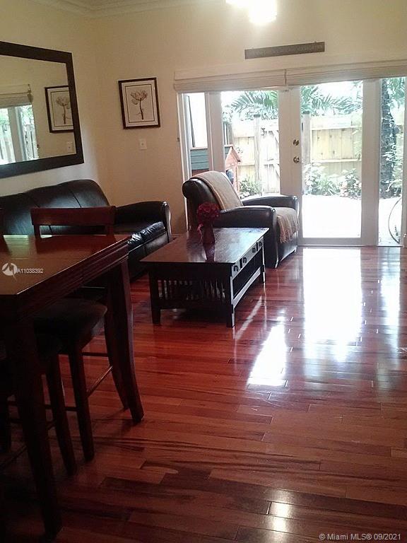 123 Southwest 17th Road Miami, FL 33129 - Photo 3 of 28 a living room with furniture wooden floor and a window