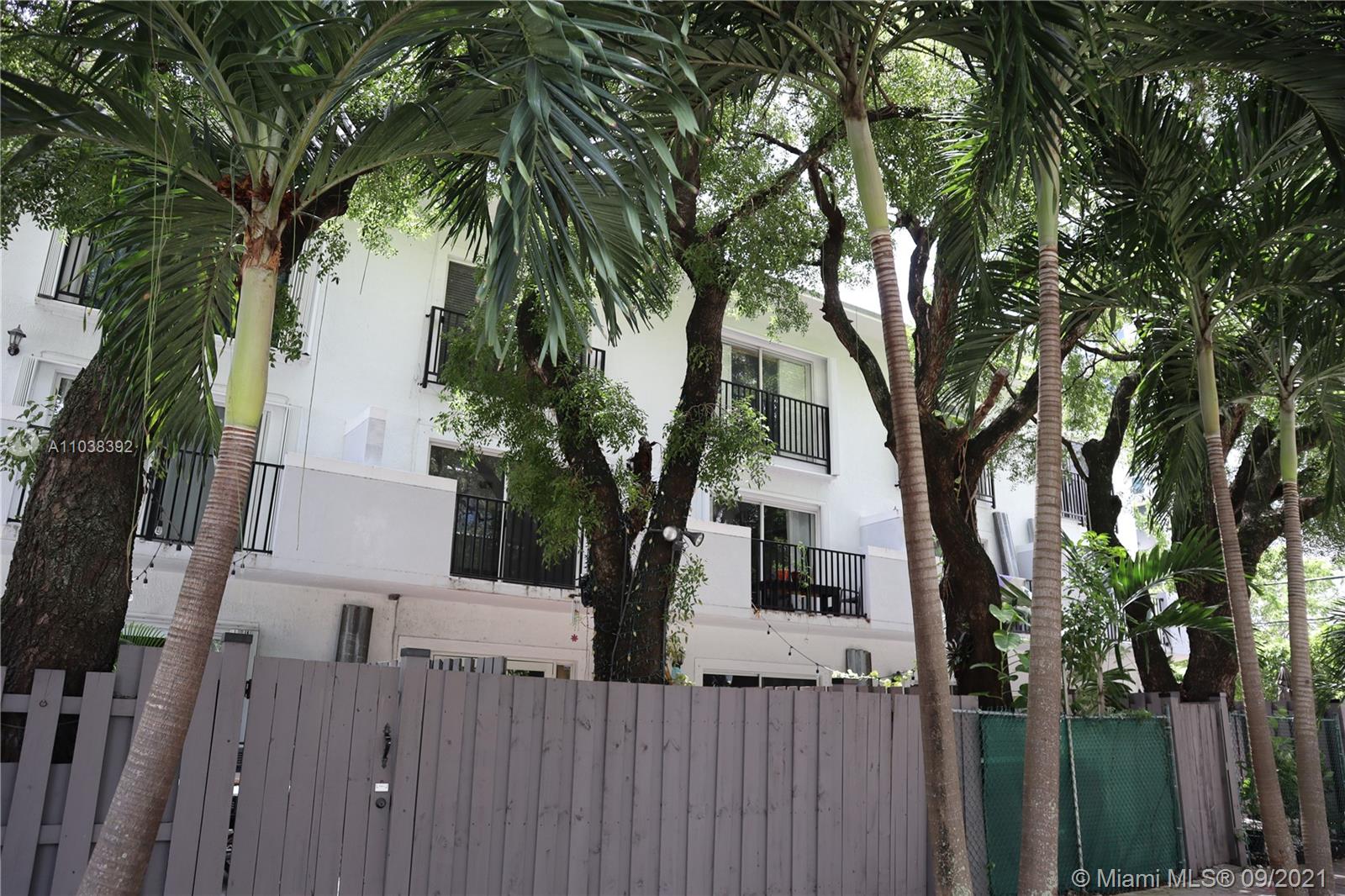 123 Southwest 17th Road Miami, FL 33129 - Photo 24 of 28 a view of a house with a tree