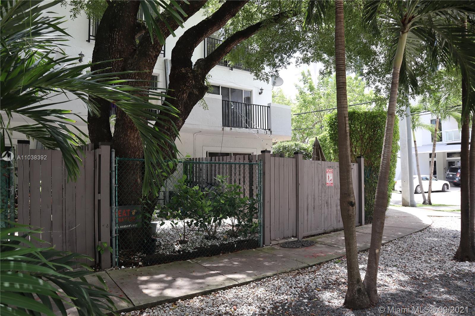 123 Southwest 17th Road Miami, FL 33129 - Photo 27 of 28 a view of a house with a tree in the background