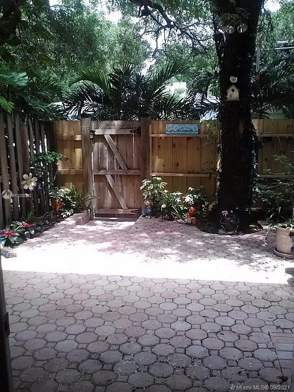 123 Southwest 17th Road Miami, FL 33129 - Photo 6 of 28 a view of backyard space and a tree