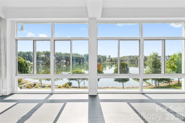 a view of a large window and a red chair