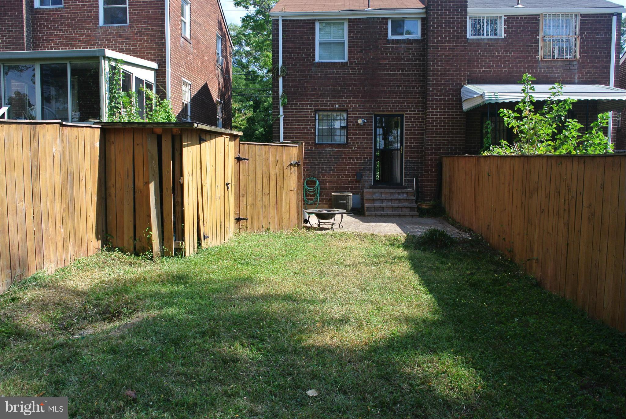 1425 Howard Road Southeast Washington, DC 20020 - Photo 12 of 13 a backyard of a house with a garden