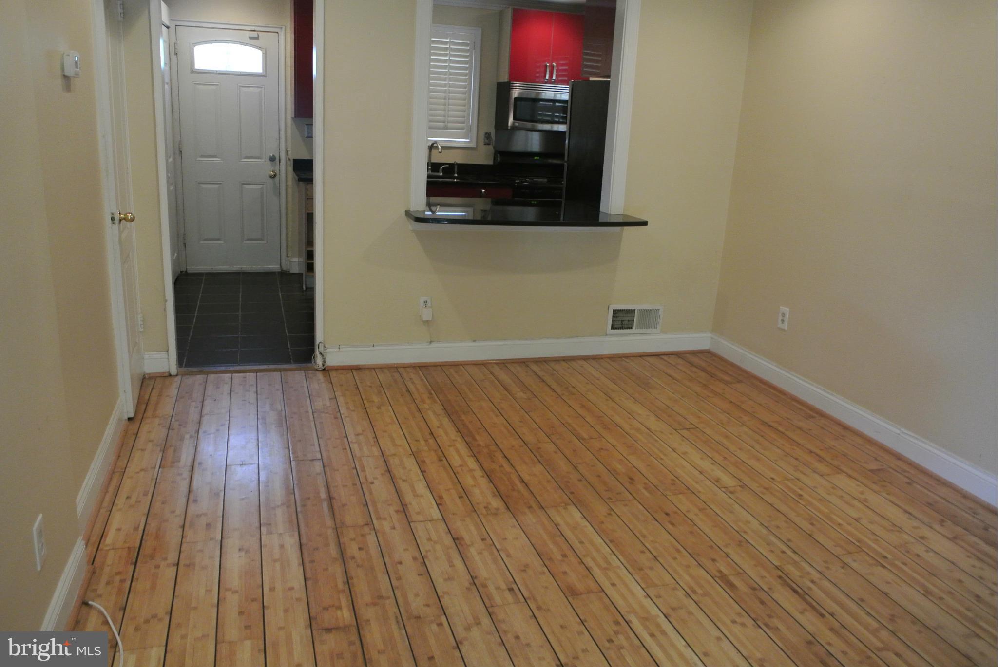 1425 Howard Road Southeast Washington, DC 20020 - Photo 4 of 13 a view of a room with wooden floor and a sink