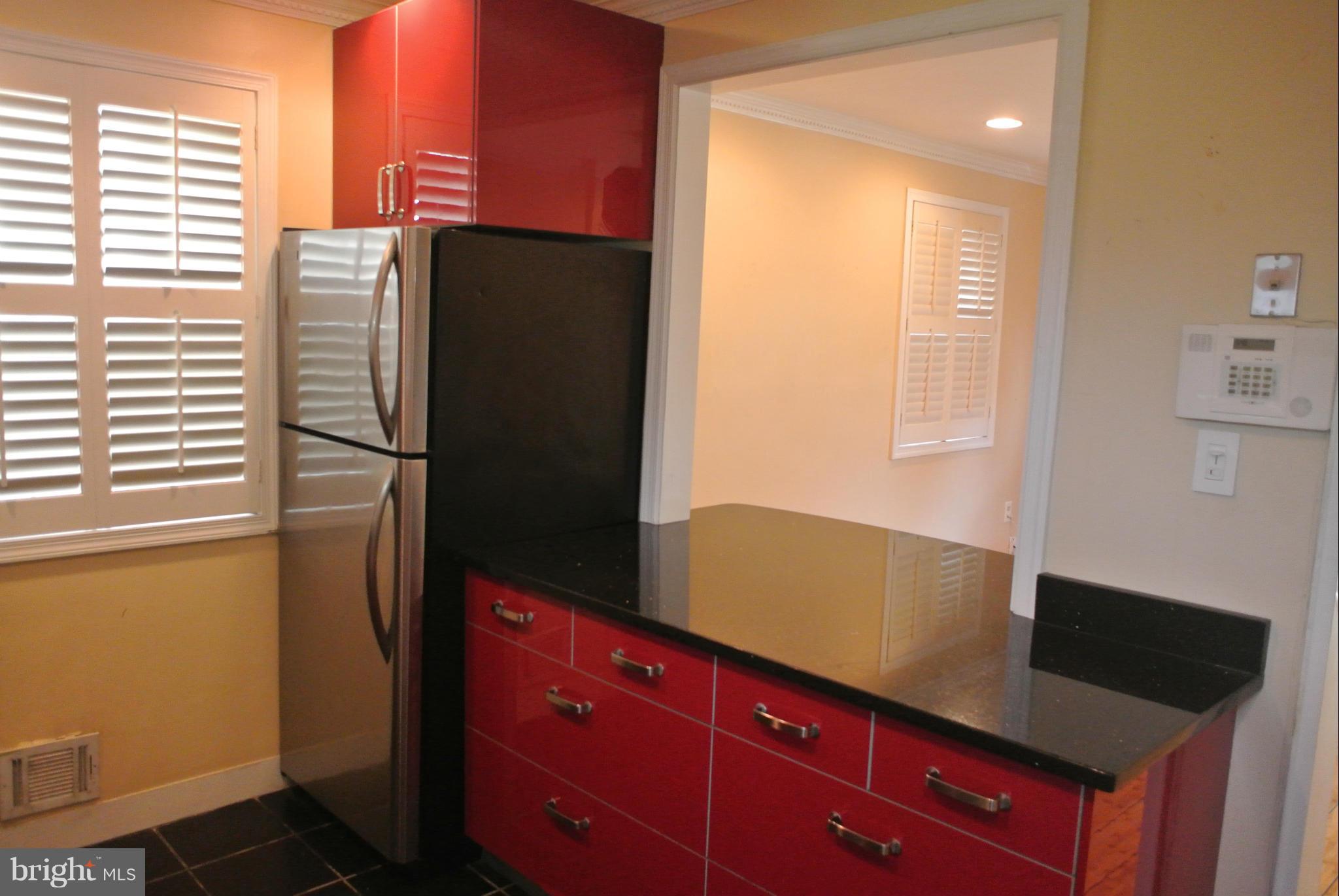 1425 Howard Road Southeast Washington, DC 20020 - Photo 8 of 13 a kitchen with a refrigerator and cabinets
