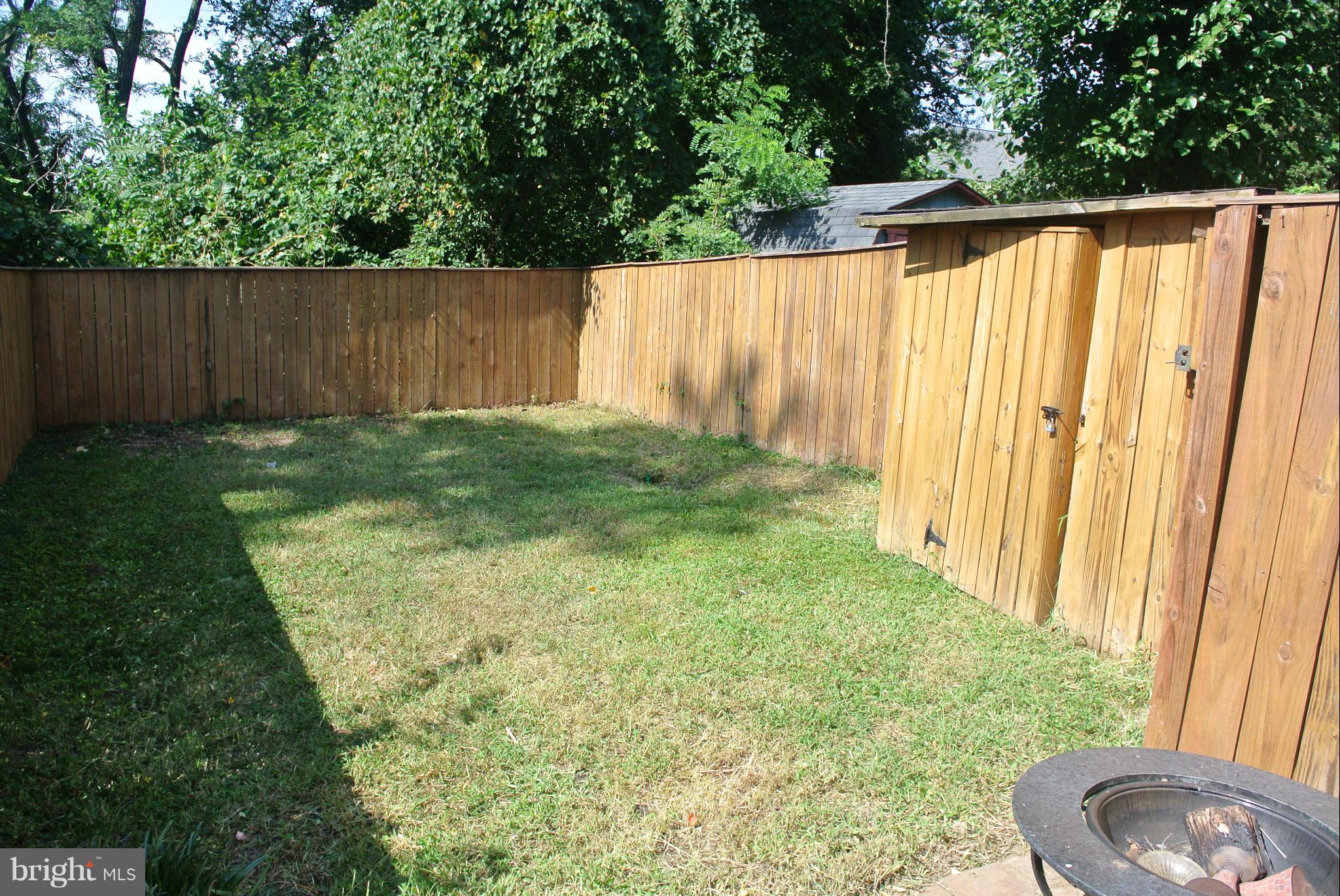 1425 Howard Road Southeast Washington, DC 20020 - Photo 10 of 13 a view of a backyard with wooden fence