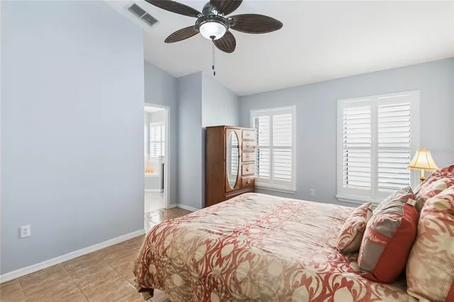 a bathroom with a tub a double vanity sink and a mirror