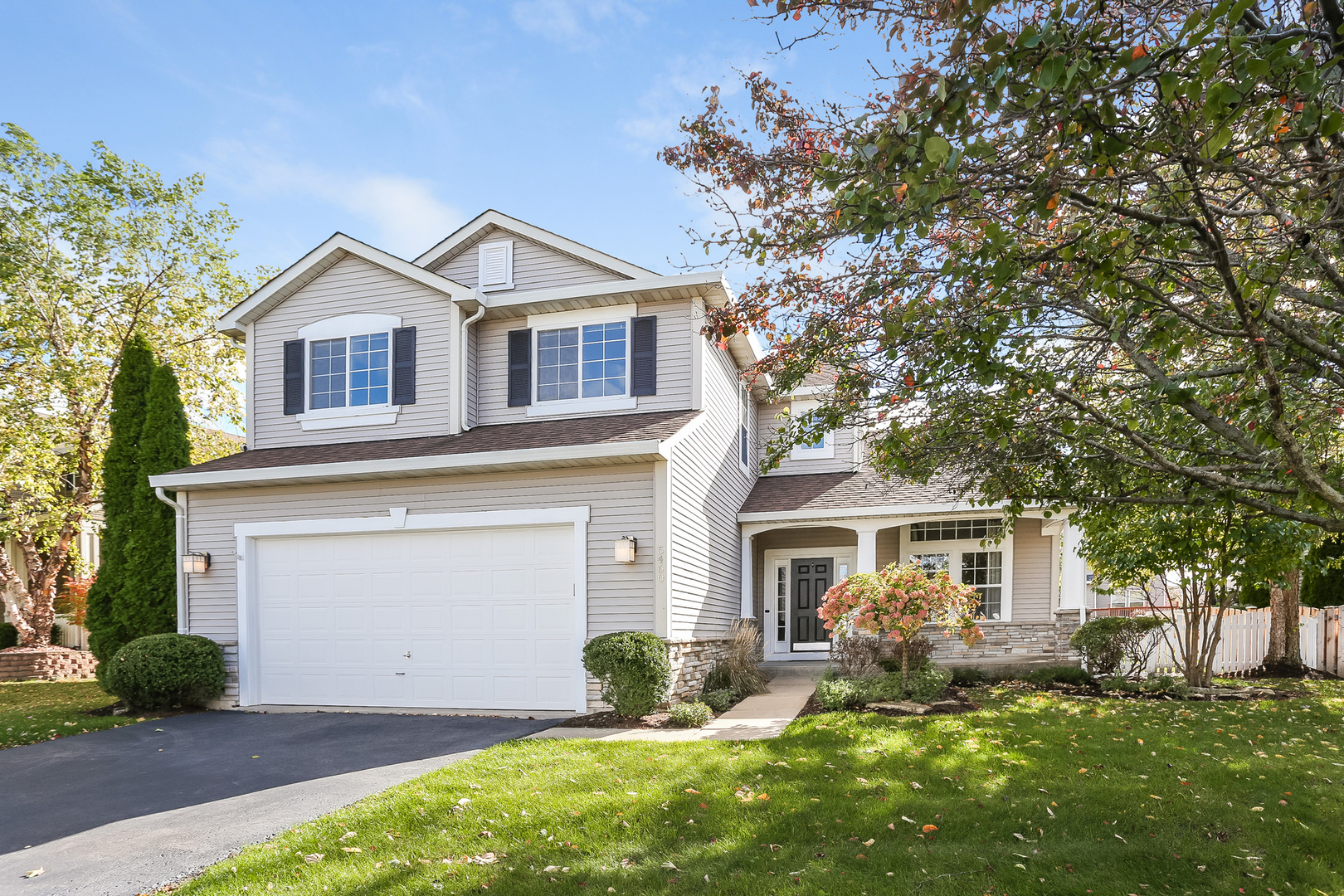 5460 Sullivan Pass Lake In The Hills, IL 60156 - Photo 1 of 51 a front view of a house with a yard and garage