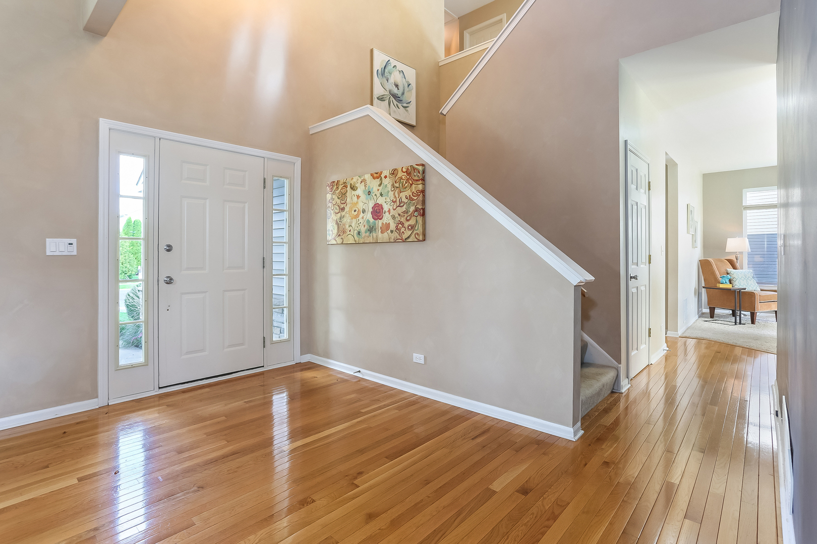 5460 Sullivan Pass Lake In The Hills, IL 60156 - Photo 11 of 51 a view of a hallway view with wooden floor and staircase