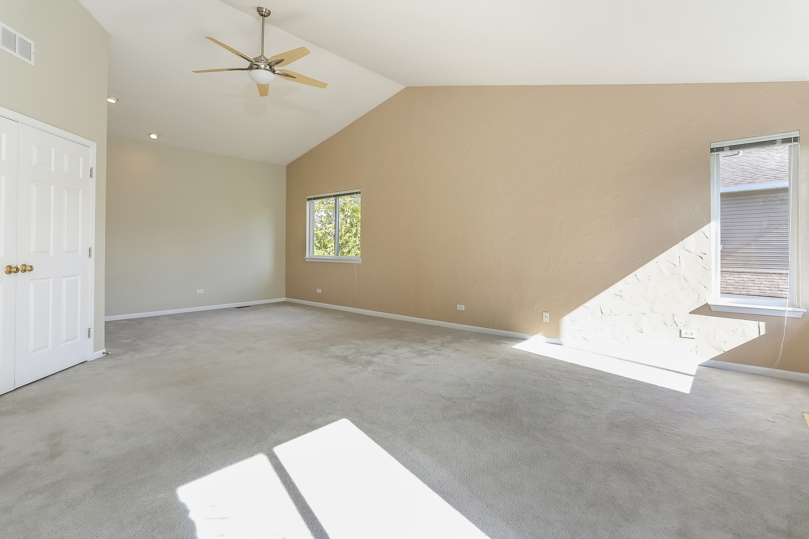 5460 Sullivan Pass Lake In The Hills, IL 60156 - Photo 27 of 51 an empty room with windows and fan