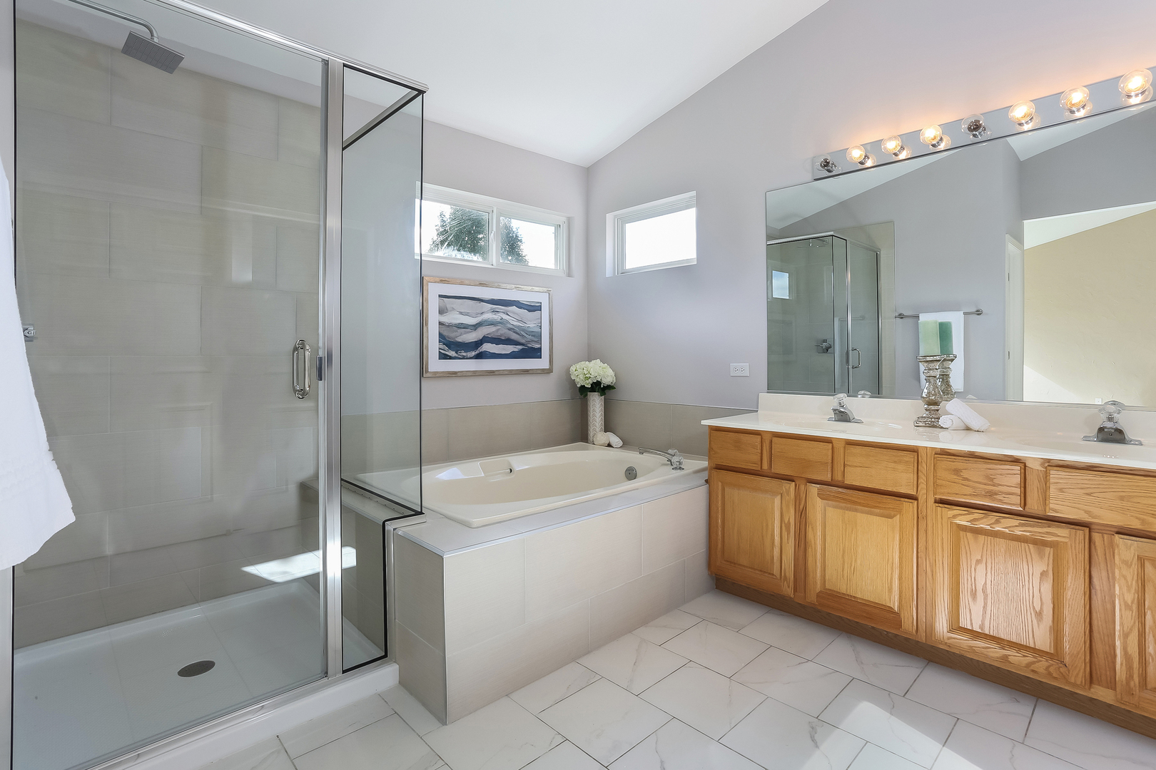 5460 Sullivan Pass Lake In The Hills, IL 60156 - Photo 28 of 51 a large bathroom with a sink a toilet a mirror a bathtub and shower