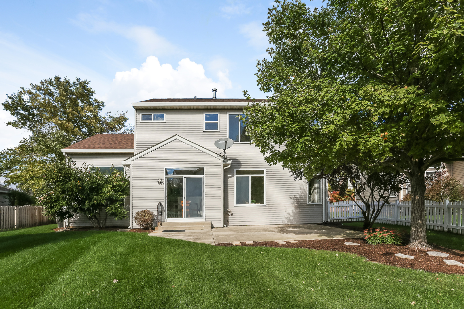 5460 Sullivan Pass Lake In The Hills, IL 60156 - Photo 43 of 51 a front view of a house with a garden and yard