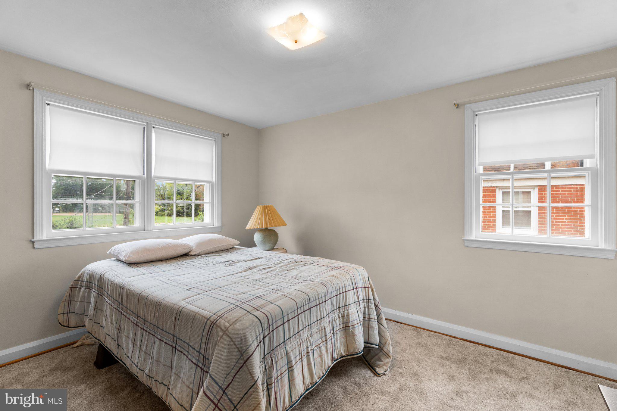 2227 Firethorn Road Middle River, MD 21220 - Photo 13 of 27 a bedroom with a bed and a window