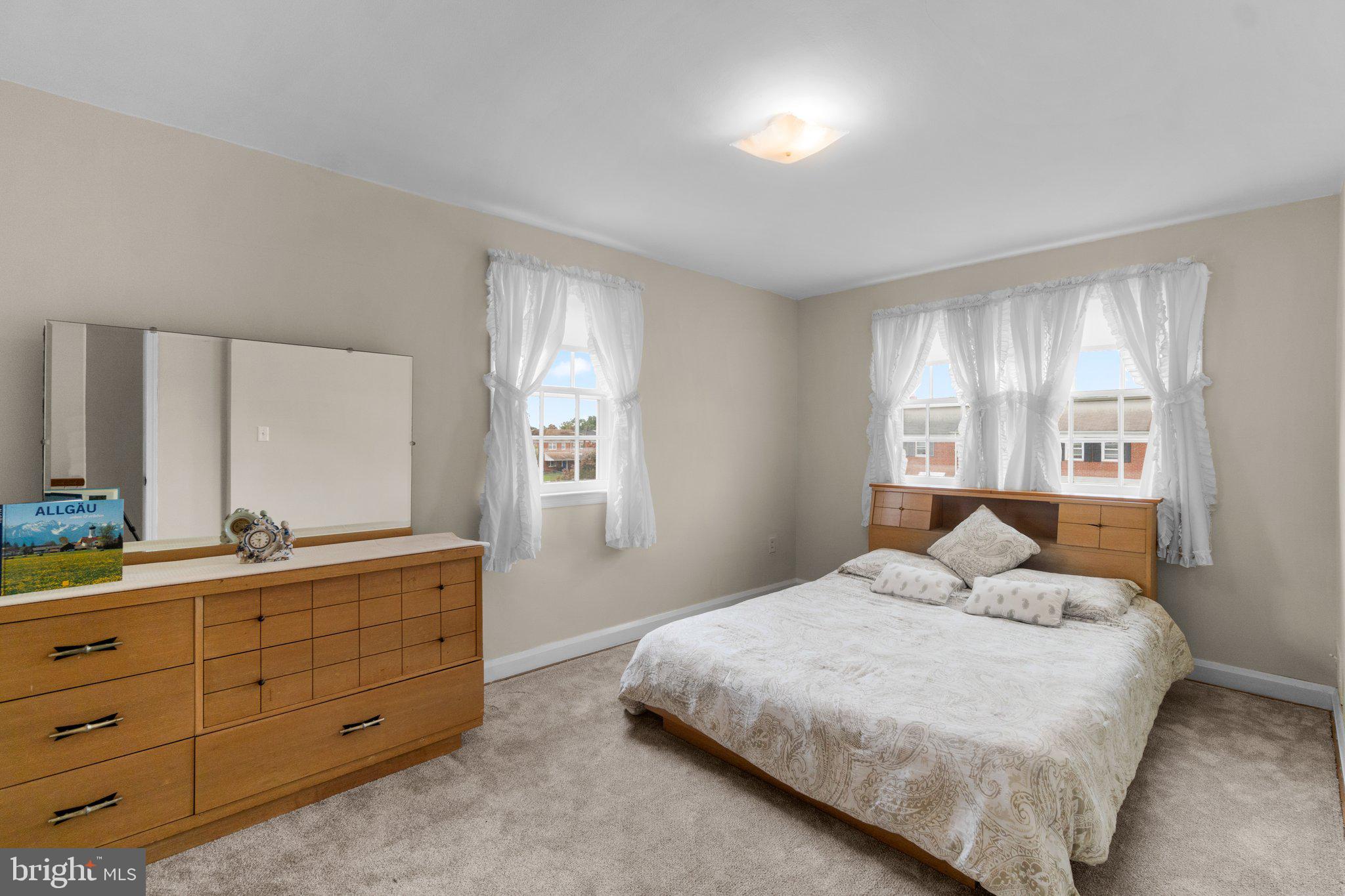 2227 Firethorn Road Middle River, MD 21220 - Photo 16 of 27 a bedroom with a bed and a closet with mirror