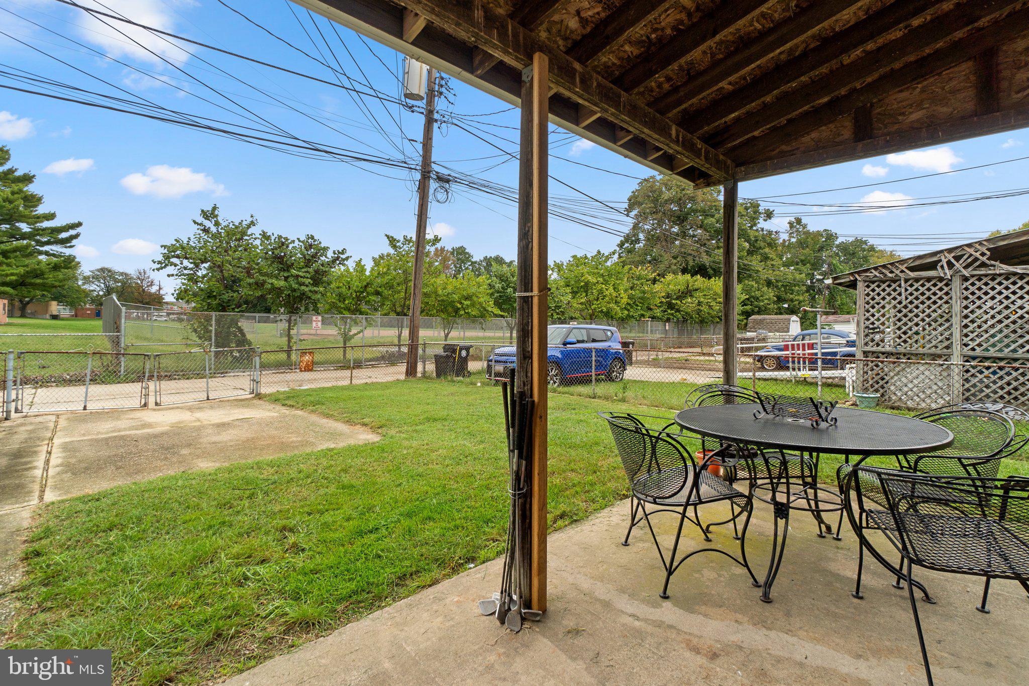 2227 Firethorn Road Middle River, MD 21220 - Photo 23 of 27 a view of a porch with furniture and a yard