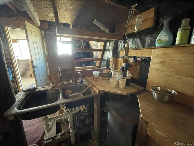 a kitchen with a sink appliances and cabinets