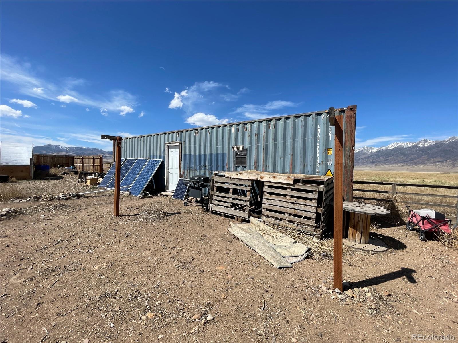 58313 County Road Villa Grove, CO 81155 - Photo 17 of 39 a view of a slide with floor to ceiling windows